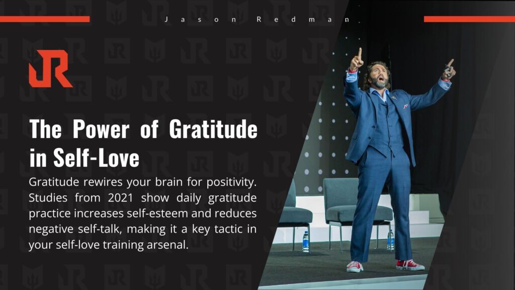 A speaker in a blue suit on stage, arms raised, discussing gratitude in self-love, with text citing 2021 studies on its benefits for self-esteem and reducing negative self-talk.