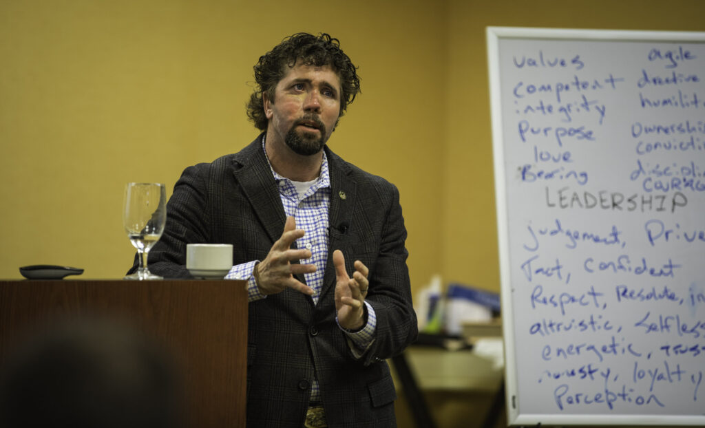 An image of Jason Redman on the stage explaining some of his best public speaking tips