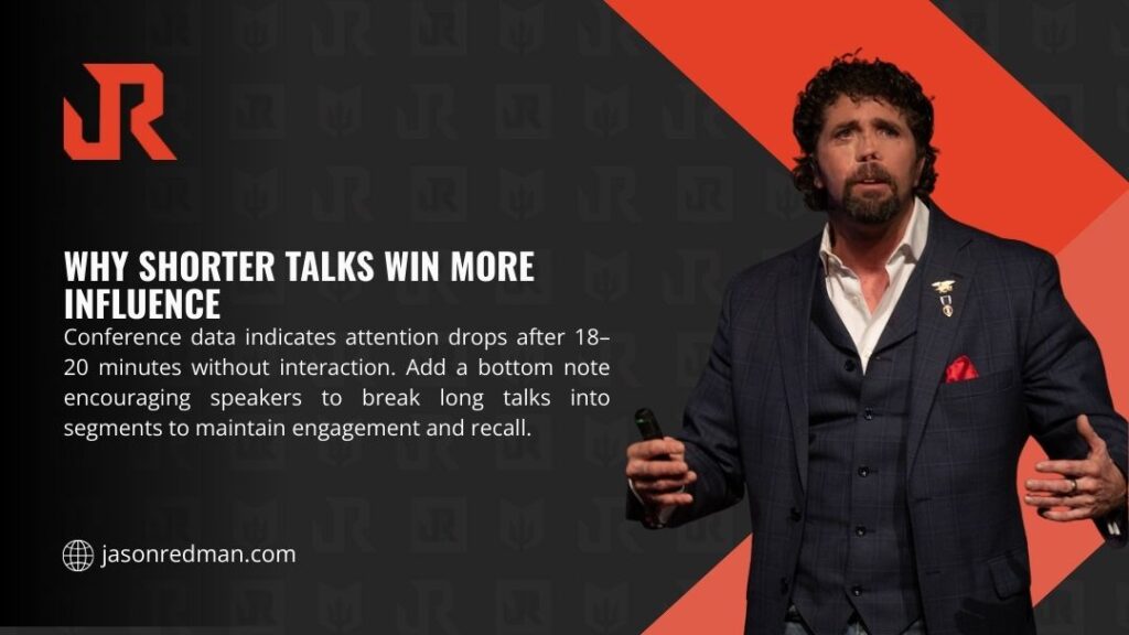 Professional speaker in suit presenting on stage with red background, illustrating how conference data shows audience attention drops after 18-20 minutes, requiring talk segmentation for engagement.