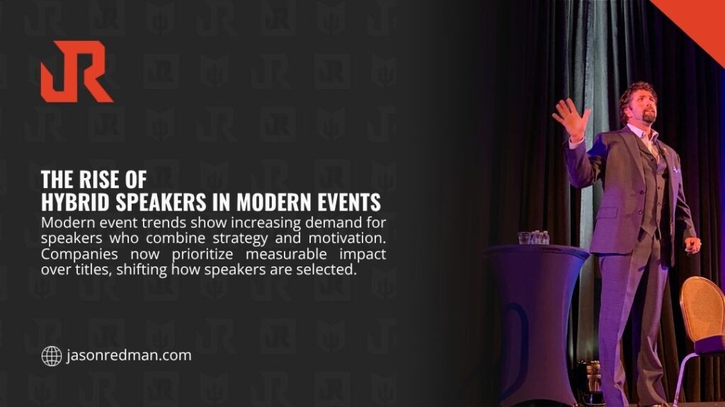 Dynamic speaker in a suit gesturing on a dimly lit event stage, representing the growing demand for hybrid speakers who combine strategy and motivation at modern events - Motivational Speaker vs Keynote Speaker Difference