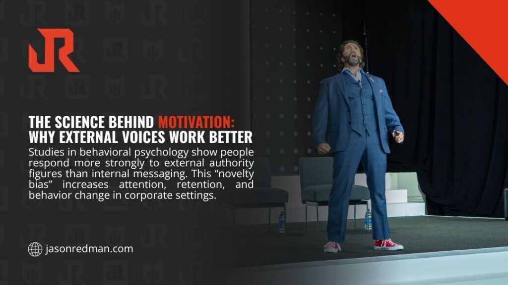 Energetic keynote speaker in a blue suit delivering a powerful motivational speech on stage, illustrating why external voices drive stronger motivation than internal messaging.